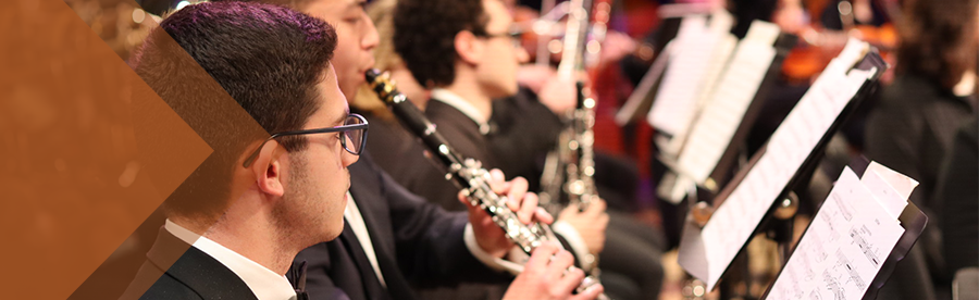 clarinet players at performance with sheet music