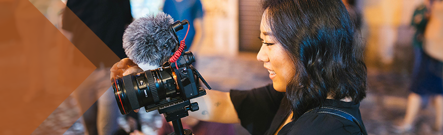 SMPA students holds camera