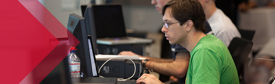 cyber security student working on computer
