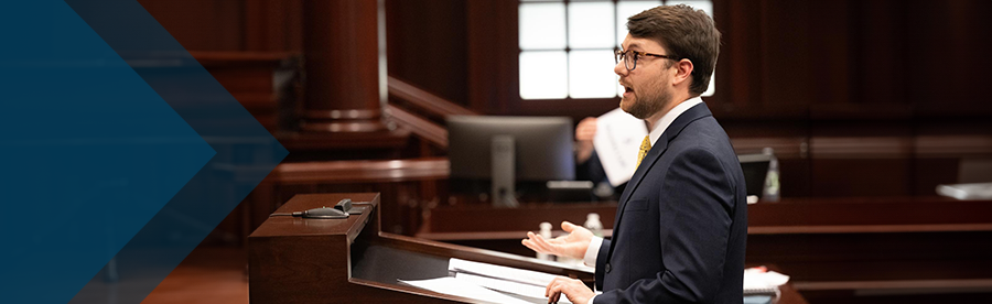 lawyer in courtroom arguing case