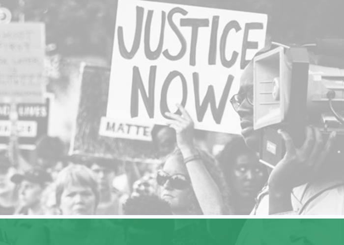 protesters holding sign for justice