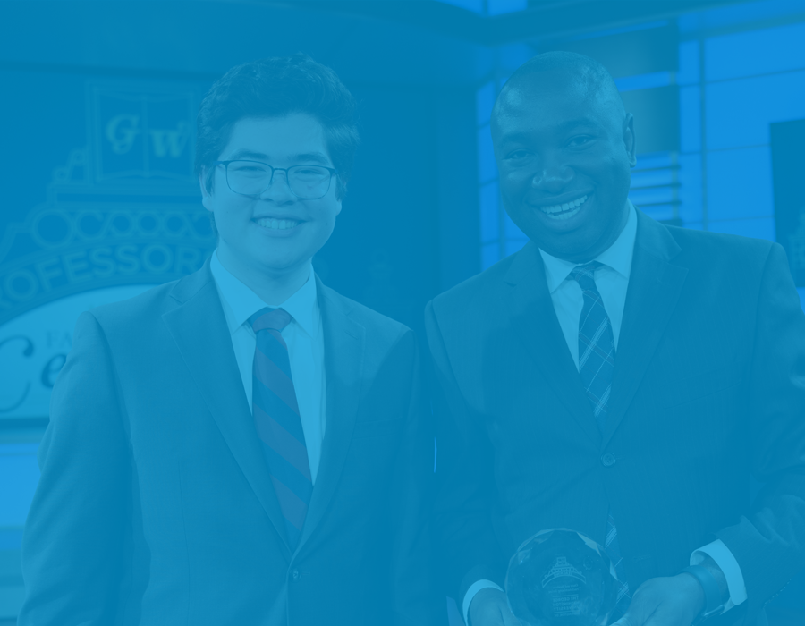 two attendees at the faculty honors ceremony smile for the camera