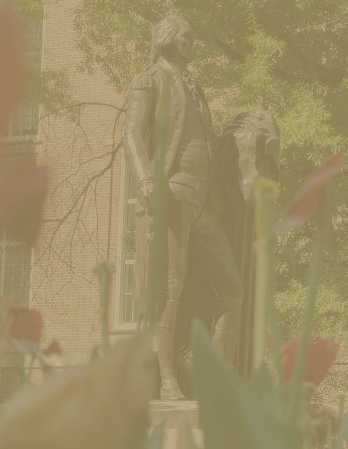 statue surrounded by students