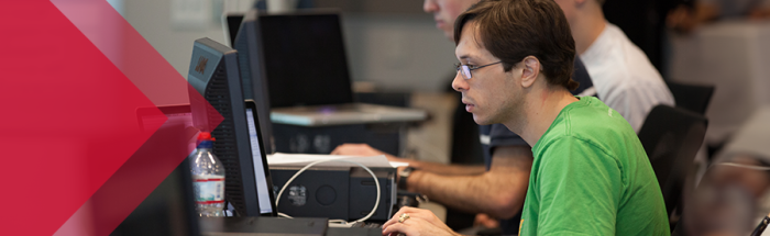 cyber security student working on computer