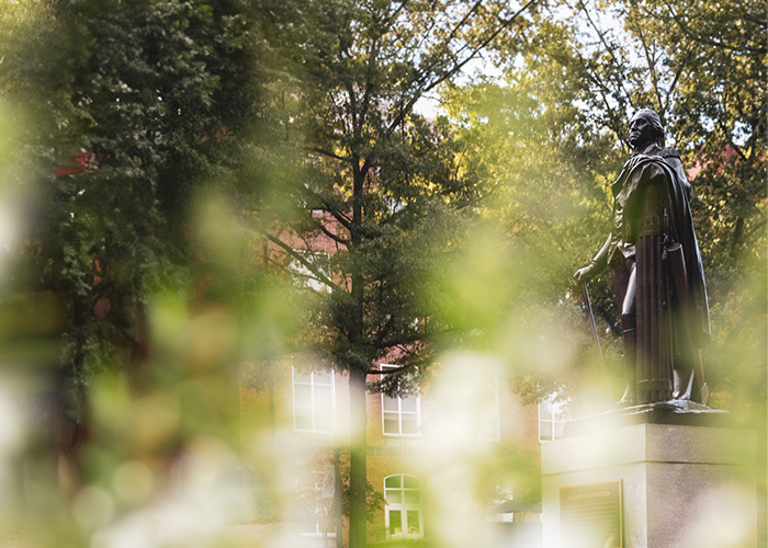 George Washington statue surrounded by plants